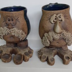 Pair of Stoneware Pottery Ugly Freaky Face Mugs